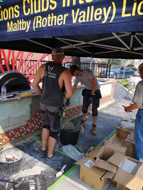 Lions gazebo shelters Maltby Miners Memorial volunteers from the heat